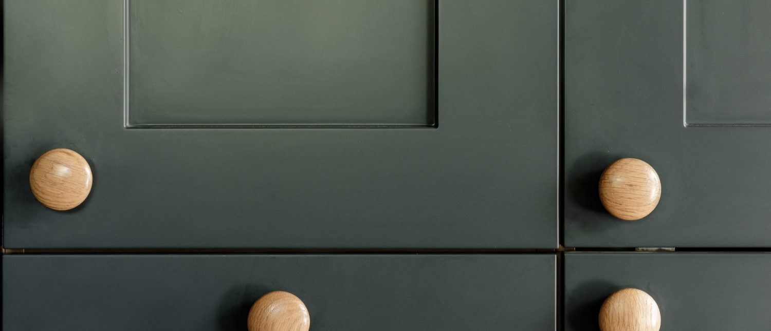 Close up shaker style cabinets with wooden circular handles