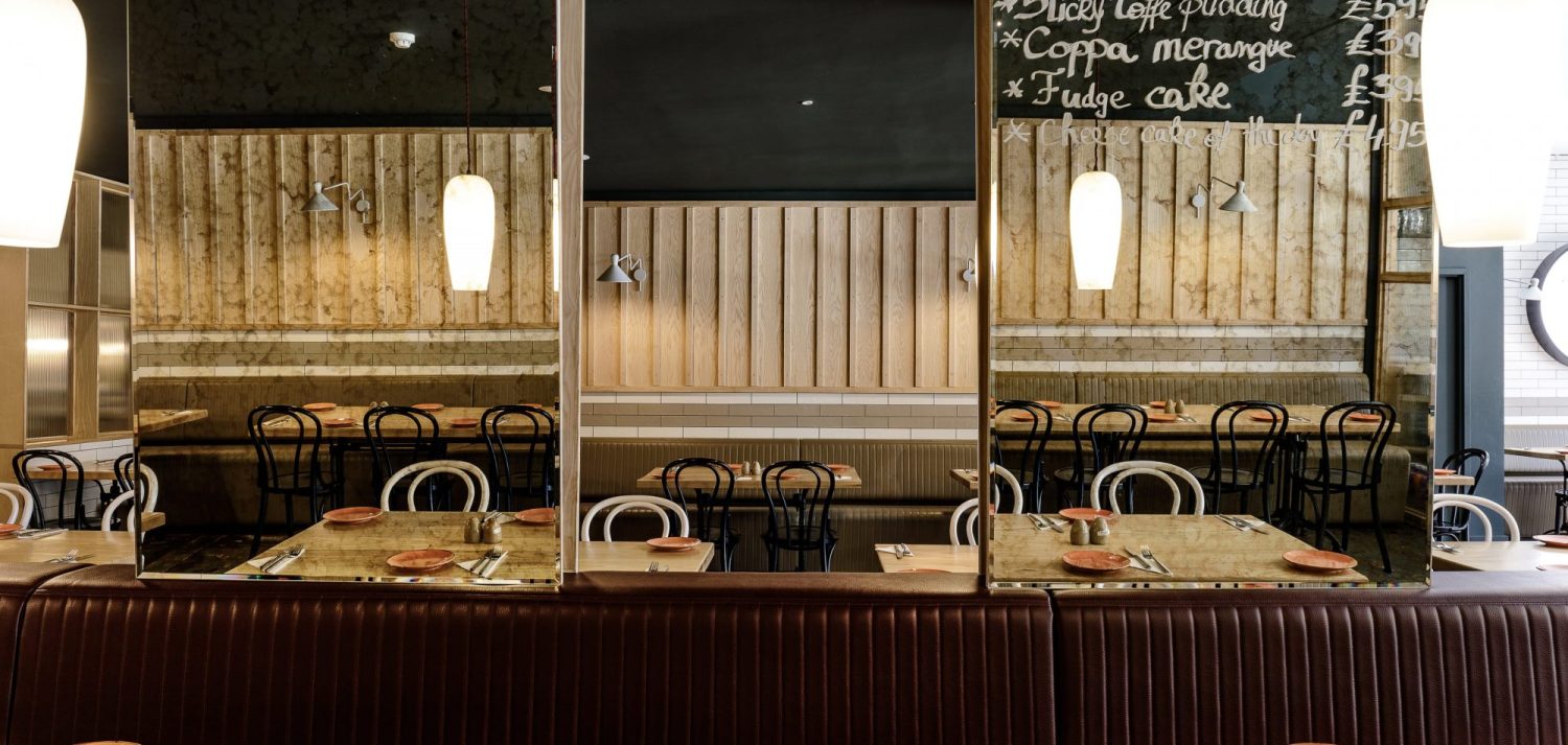 Mirror partitions in restaurant seating area