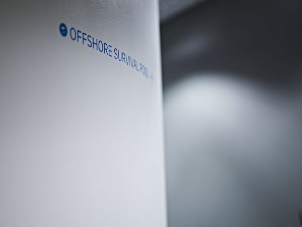 Curved white wall with a blue text graphic