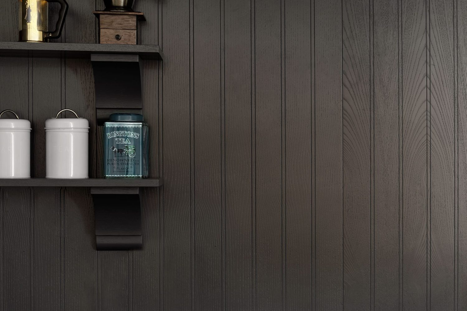 Shelves on black panelled wall with ornaments