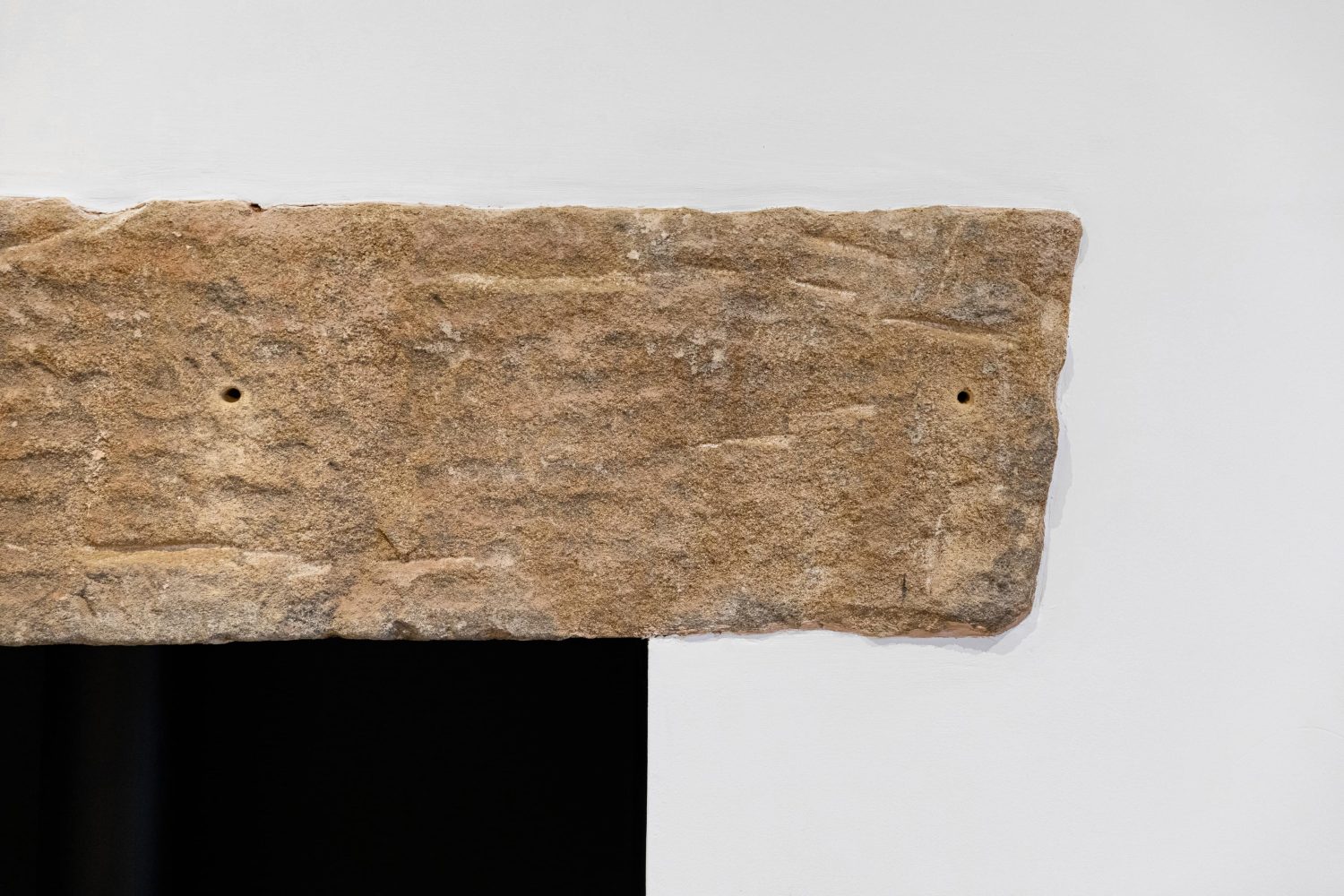 Stone detailing above log burner close up