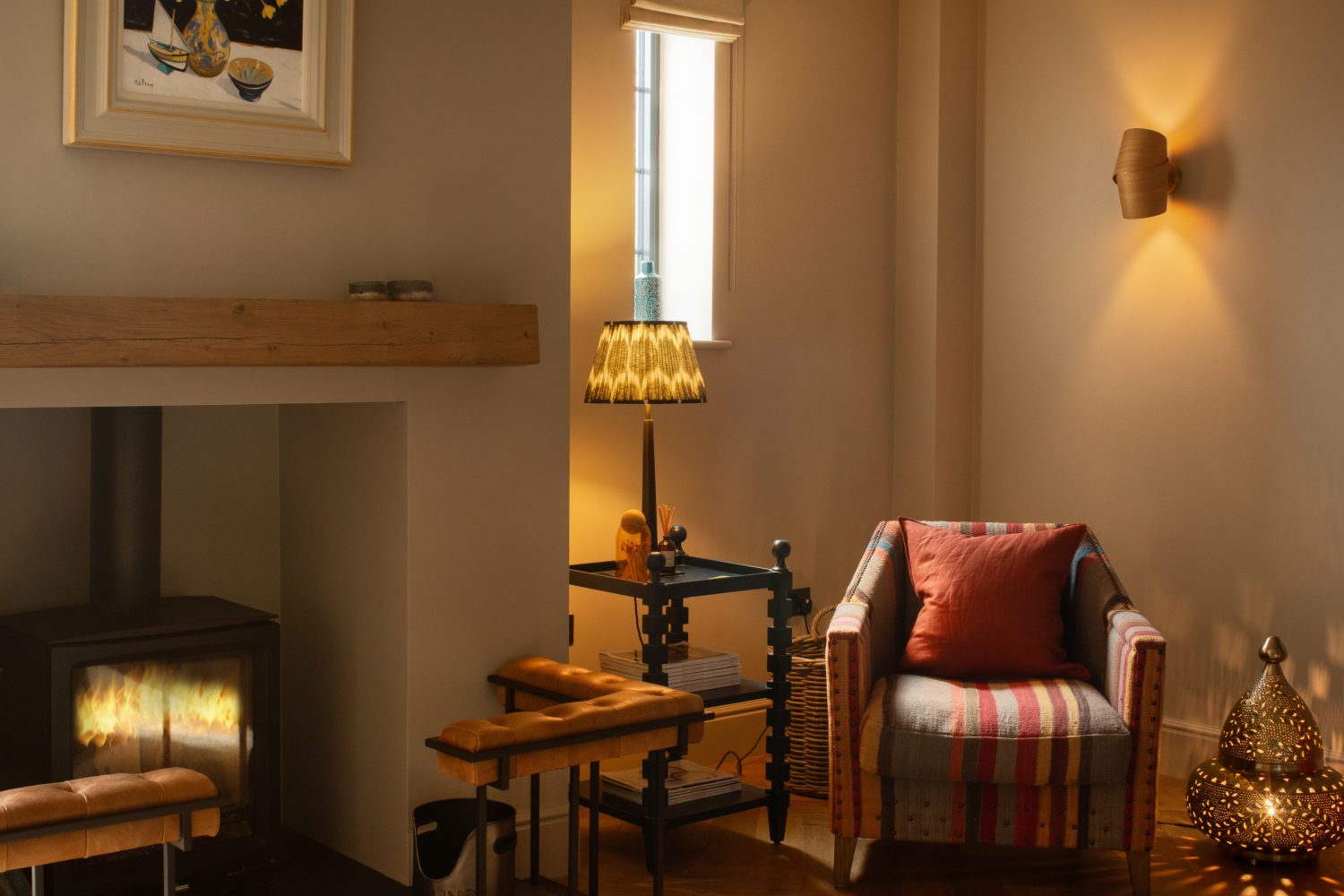 Multi-colour chair with log burner to the left and thin window above